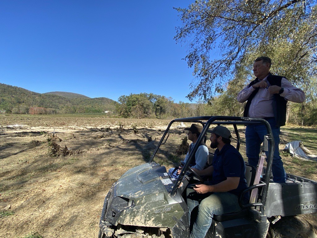 Three people in a motorized cart