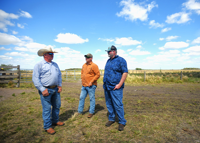 Three People standing in a field