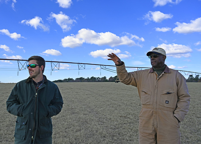 Two standing in a field