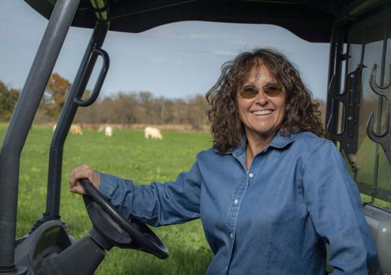 Tammy Higgins sits in her tractor