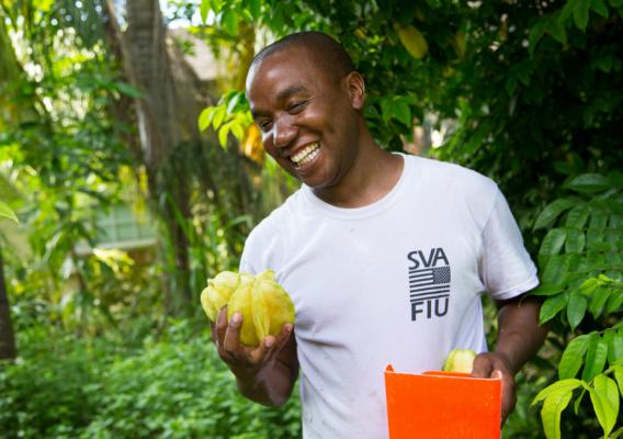 Farmer holding fruit