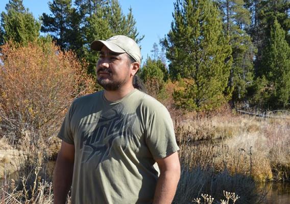 Eric Hawley, Burns Paiute Tribal chair observes the new growth along the banks of Big Creek.