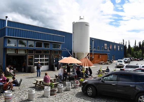 Customers enjoy cold beers on a summer day at Denali Brewing Company in Talkeetna, Alaska. Photo by Tracy Robillard, NRCS. 