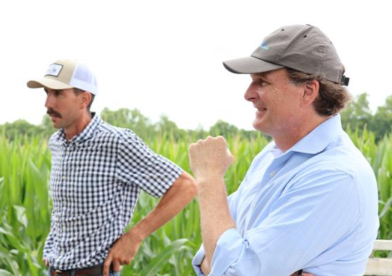 Two people standing in a field